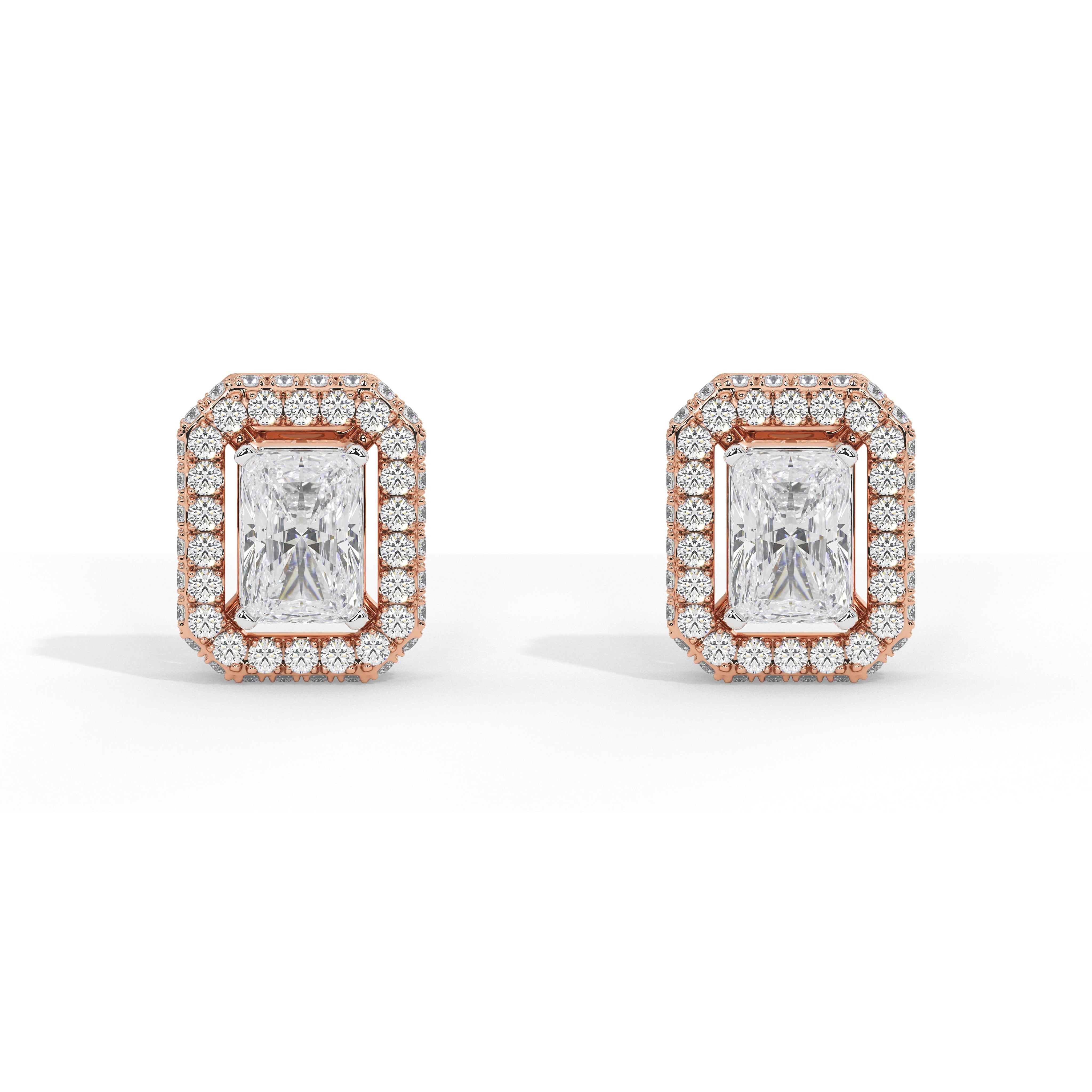 A pair of rectangular stud earrings featuring emerald-cut center stones surrounded by a halo of small round stones in a rose gold setting, shown on a clean white background.