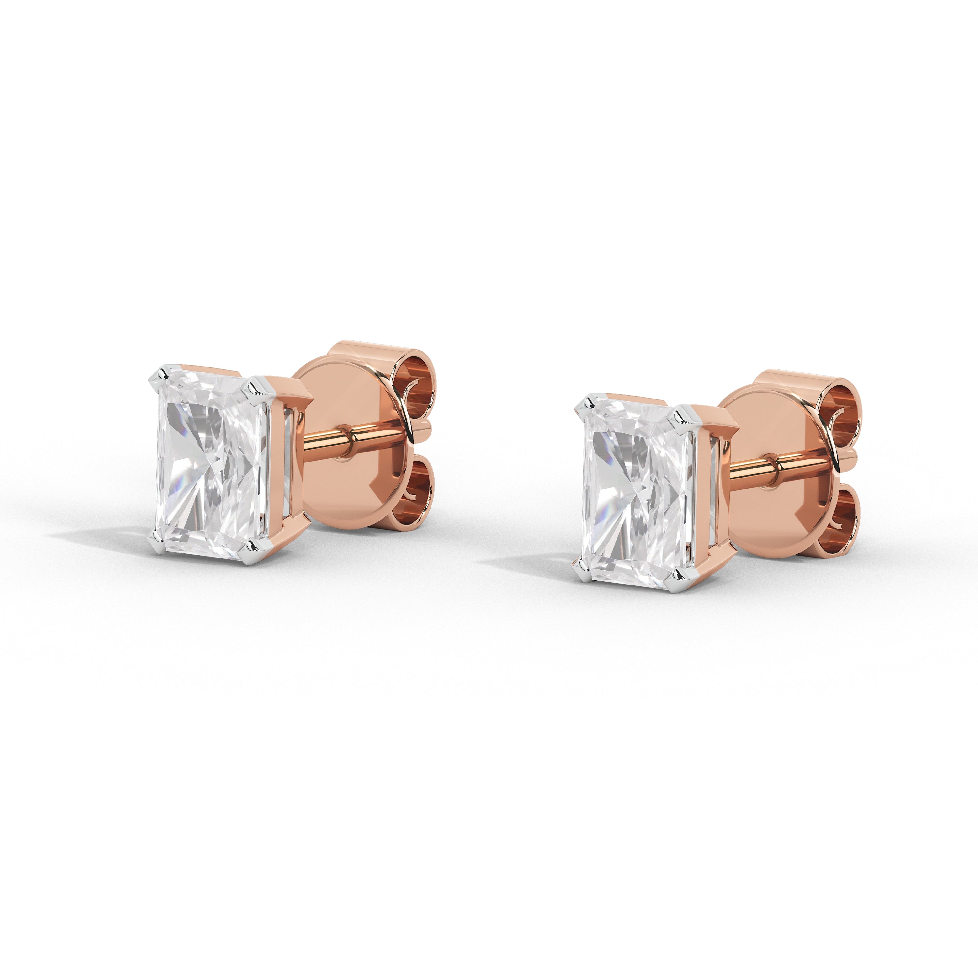 A pair of rose gold stud earrings with rectangular clear gemstones, shown from a three-quarter angle on a clean white background.