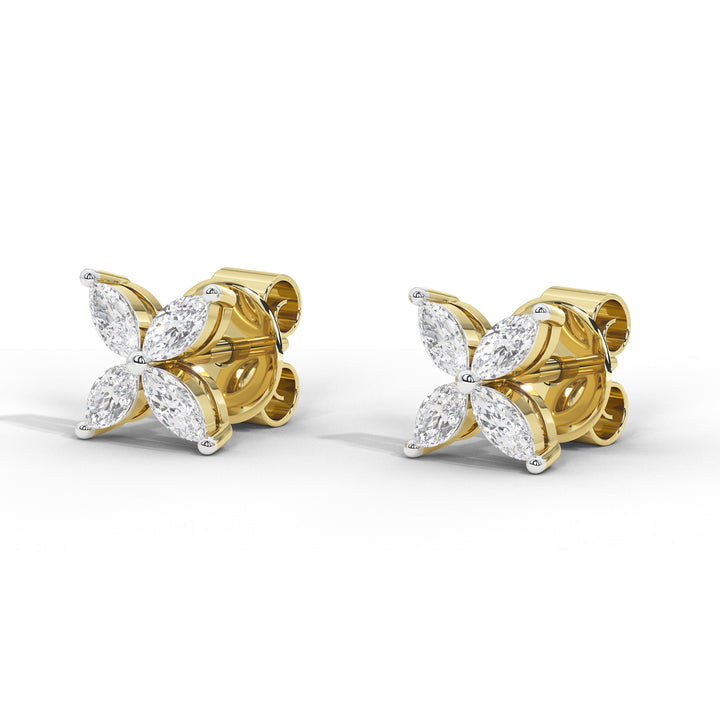 A pair of yellow gold stud earrings featuring marquise-cut clear gemstones arranged in a flower-like cluster, shown on a clean white background.