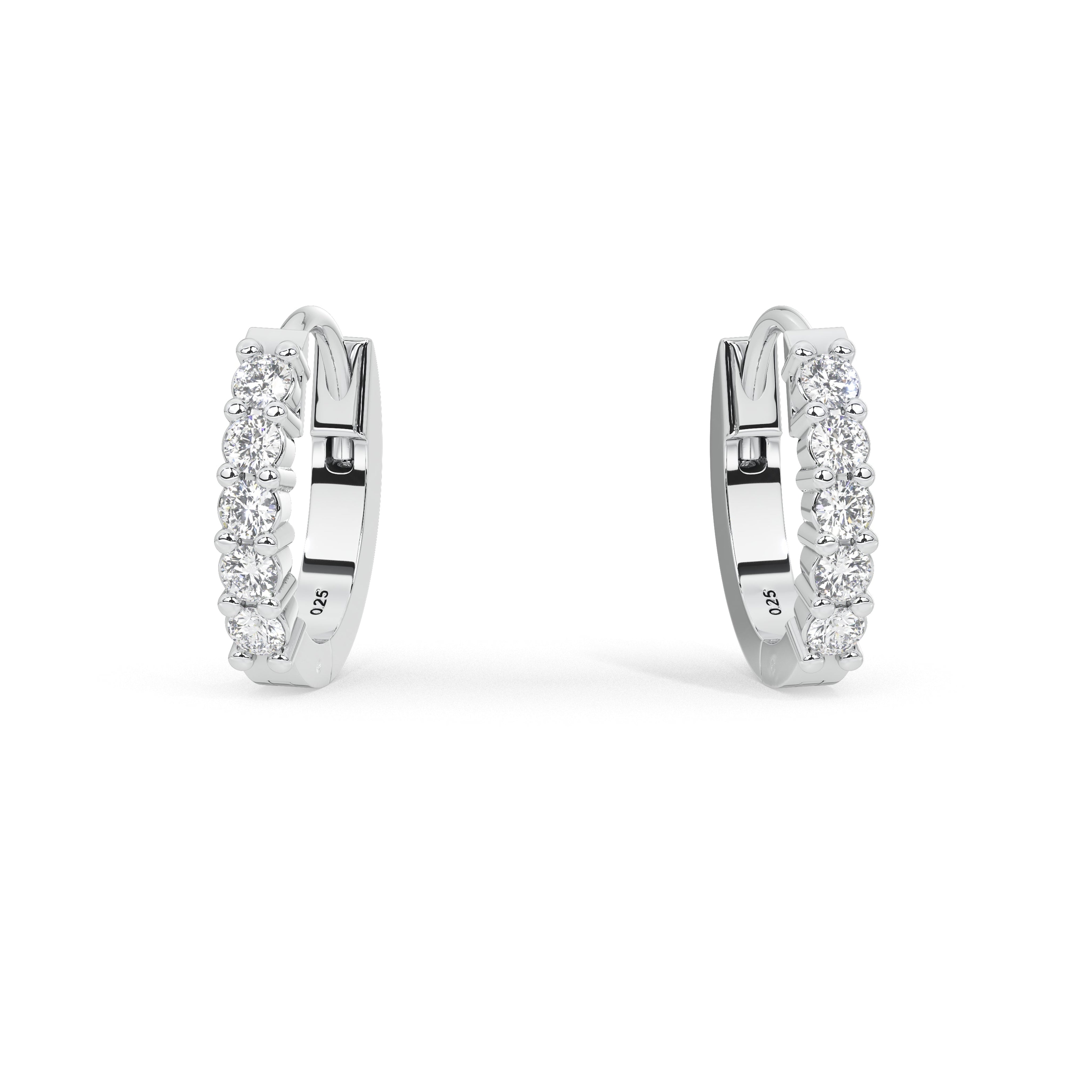 A pair of white gold huggie hoop earrings set with clear pavé diamonds, shown against a plain white background.