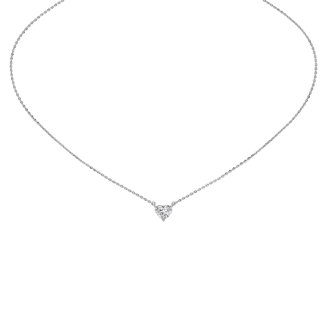 A delicate silver chain necklace with a small heart-shaped cluster of clear stones at the center, displayed on a solid white background.