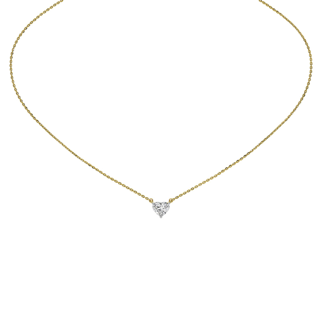 A delicate yellow gold chain necklace with a small heart-shaped diamond pendant, shown against a solid white background.