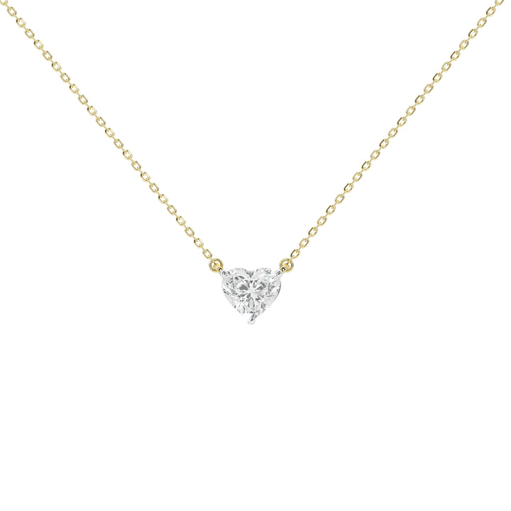 A delicate yellow gold chain necklace with a small heart-shaped diamond pendant on a plain white background.
