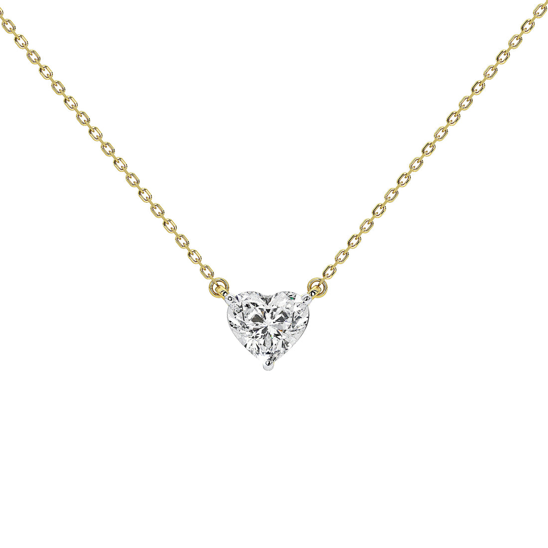 A delicate yellow gold chain necklace with a small heart-shaped diamond pendant, shown against a solid white background.