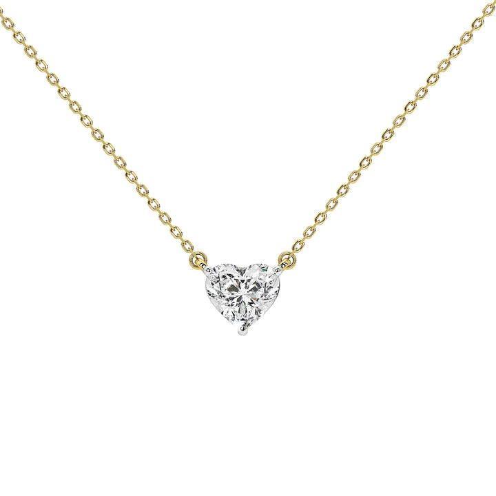 A delicate yellow gold chain necklace with a small heart-shaped diamond pendant, shown against a solid white background.