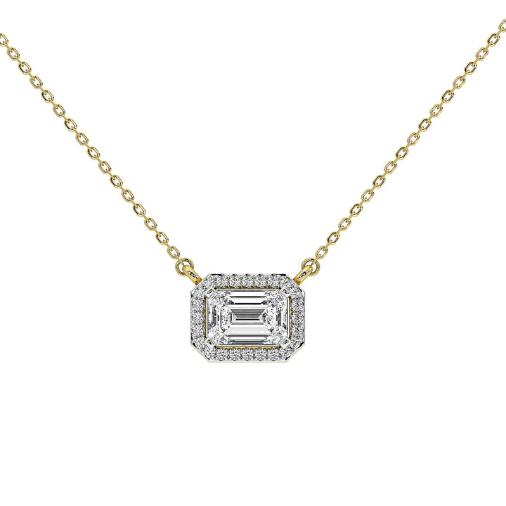 A gold chain necklace with an emerald-cut halo pendant set with clear gemstones, shown on a plain white background.