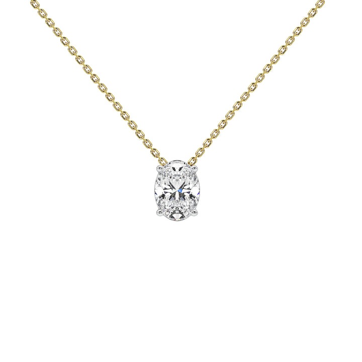 A delicate yellow gold chain necklace with a single oval-cut clear diamond pendant in a silver-toned setting, shown against a plain white background.
